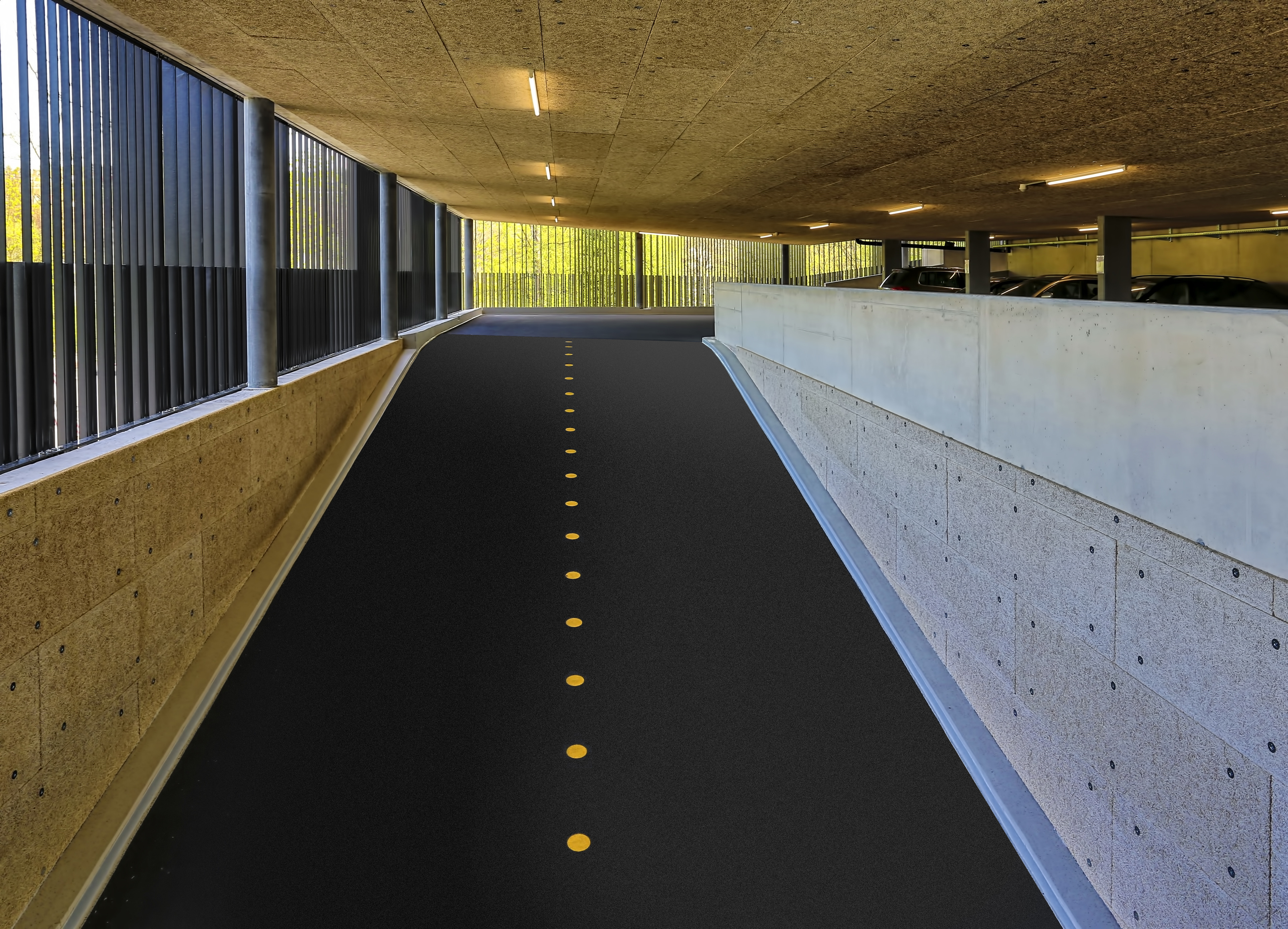 Car park ramp with yellow dot divider in parking garage in Switzerland