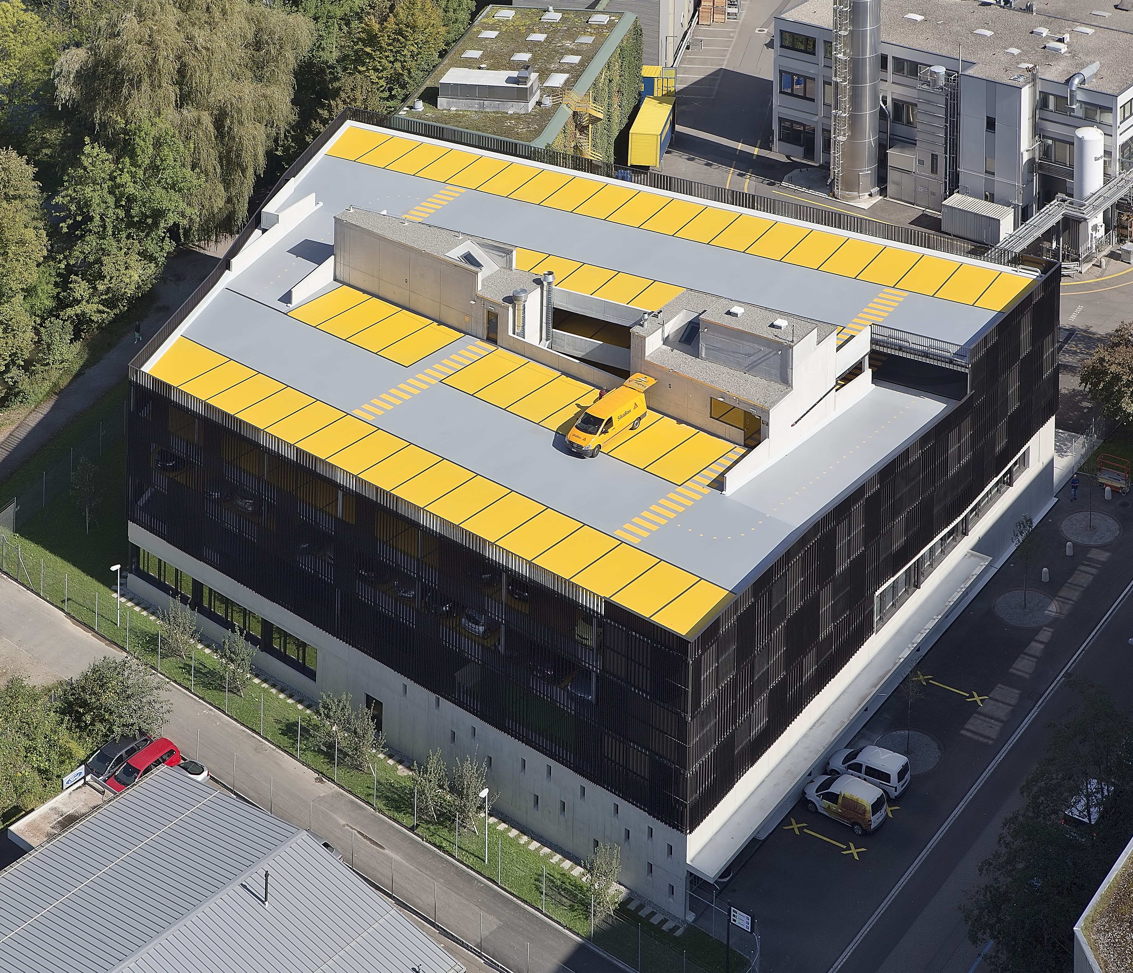 Car on top floor of parking garage made with Sikafloor coating system